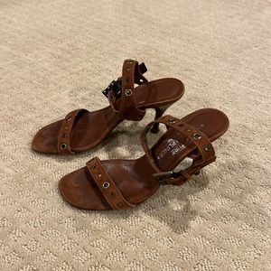 Donald Pliner brown suede sandal.  Grommet detail.